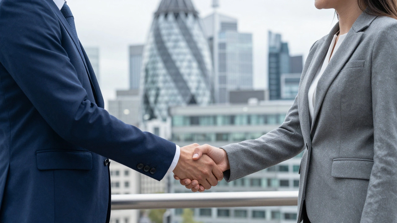 Two professionals performing a firm handshake in a London office.